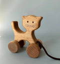 Wooden cat on wheels