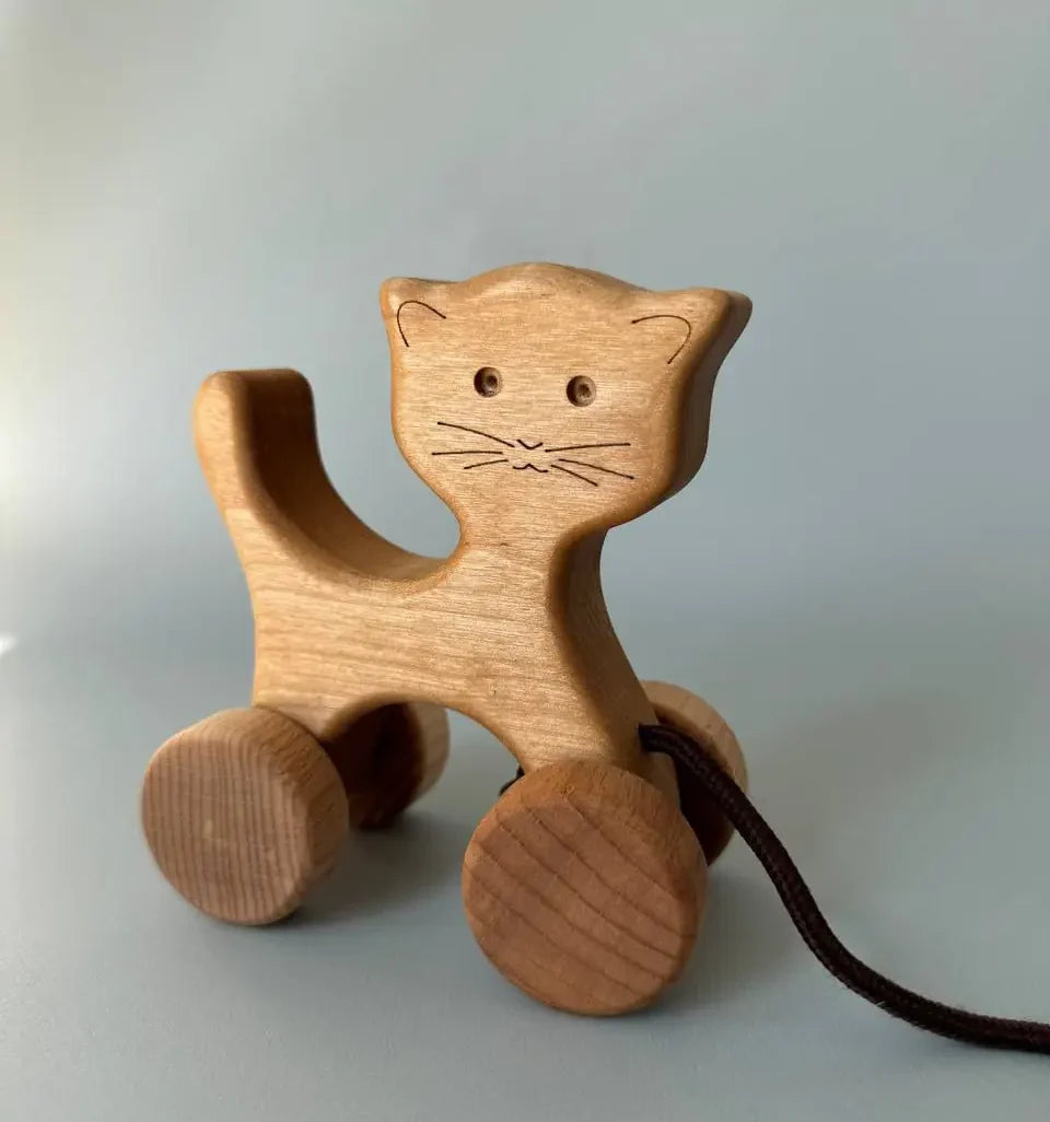 Wooden cat on wheels